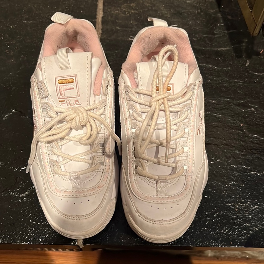 Pink and white Fila sneakers
